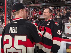 Chris Neil and Chris Phillips shake hands after a post-game skate in what could be Phillips last time in a Senators uniform.