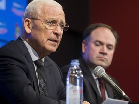 Former Ottawa Senators' General Manager, Bryan Murray, left, speaks at a press conference where he announced he's stepping down as general manager of the team but staying on as senior hockey advisor at the Canadian Tire Centre Sunday, April 10, 2016. Pierre Dorion, right, is the team's new general manager.