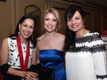 From left, author Reva Seth with Catherine Clark, president of Catherine Clark Communications, and CPAC producer Catherine Christie-Luff at the Politics and Pen dinner held at the Fairmont Chateau Laurier on Wednesday, April 20, 2016, in support of The Writers' Trust of Canada.