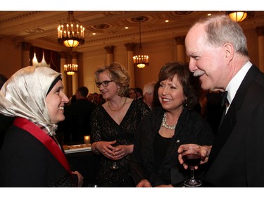 From left, Canadian author Monia Mazigh in conversation with Radio-Canada news anchor CÈline Galipeau and Official Languages Commissioner Graham Fraser at the Politics and Pen dinner held at the Fairmont Chateau Laurier on Wednesday, April 20, 2016, in support of The Writers' Trust of Canada.