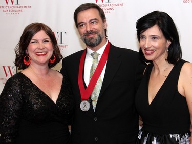 From left, CBC Ottawa Radio morning show host Robyn Bresnahan with Ottawa urban planner and author Alain Miguelez and CBC journalist Joanne Chianello at the Politics and Pen dinner held at the Fairmont Chateau Laurier on Wednesday, April 20, 2016, in support of The Writers' Trust of Canada.