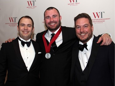 From left, Dan Mader with Ottawa city councillor and author Jody Mitic and Emmanuel Morin with Hill + Knowlton Strategies at the Politics and Pen dinner held at the Fairmont Chateau Laurier on Wednesday, April 20, 2016, in support of The Writers' Trust of Canada.