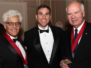 From left, Gowling WLG partner Jacques Shore with Andrew Harris, manager of public policy at Amazon, and CBC news anchor Peter Mansbridge at the Politics and Pen dinner held at the Fairmont Chateau Laurier on Wednesday, April 20, 2016, in support of The Writers' Trust of Canada.