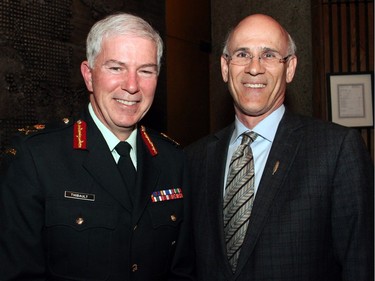 From left, Lieutenant-General Guy Thibault, vice chief of defence staff, with Clerk of the Privy Council Michael Wernick at the launch of Gov. Gen. David Johnston's new book, The Idea of Canada: Letters to a Nation, held at the National Arts Centre on Tuesday, April 19, 2016, as part of the Ottawa International Writers Festival. (Caroline Phillips / Ottawa Citizen)