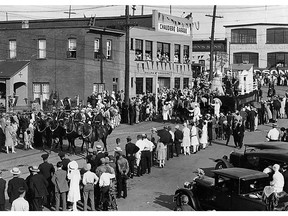 Canada's Diamond Jublilee July 1, 1927 is celebrated in this parade going by the intersection of Broad Street and Wellington Street in LeBreton Flats.