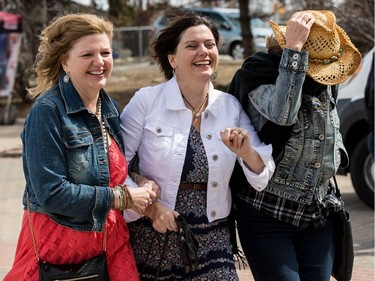 Garth Brooks fans make their way in the bitter cold wind outside of the Canadian Tire Centre on Sunday April 3, 2016.