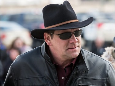 Garth Brooks fans make their way in the bitter cold wind outside of the Canadian Tire Centre on Sunday April 3, 2016.