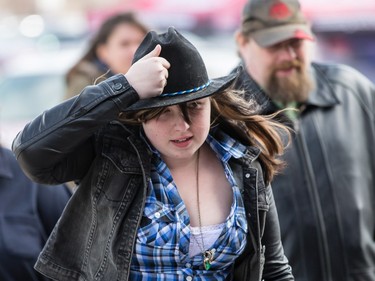 Garth Brooks fans make their way in the bitter cold wind outside of the Canadian Tire Centre on Sunday April 3, 2016.