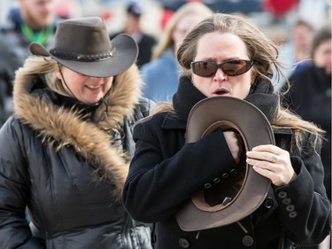 Garth Brooks fans make their way in the bitter cold wind outside of the Canadian Tire Centre on Sunday April 3, 2016.