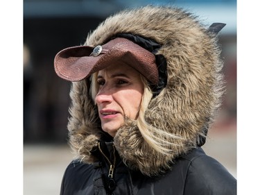 A bundled-up Garth Brooks fan makes her way to the Canadian Tire Centre in the bitter cold on Sunday, April 3, 2016.