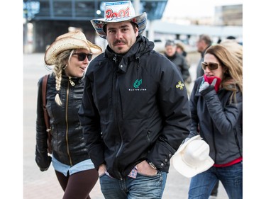 Garth Brooks fans make their way in the bitter cold wind outside of the Canadian Tire Centre on Sunday April 3, 2016.