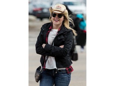 Garth Brooks fans make their way in the bitter cold wind outside of the Canadian Tire Centre on Sunday April 3, 2016.