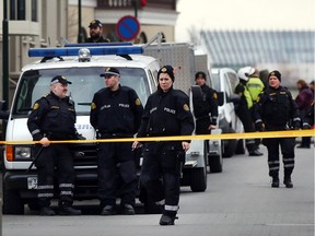 REYKJAVIK, ICELAND - APRIL 05: Police stand outside of the Parliament building following the government shake-up in the wake of the Panama Papers crisis on April 5, 2016 in Reykjavik, Iceland. Prime Minister Sigmundur David Gunnlaugsson resigned after news broke that he had hid his assets in an offshore shell-company whose existence was revealed by the Panama Papers.