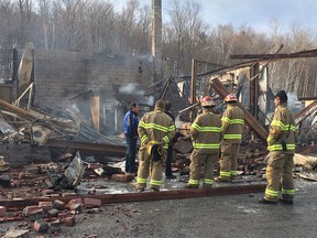 Firefighters at the scene of Thursday night's fire at Ben’s Towing at 623 Rte. 105 in Chelsea, QC