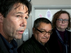 Ontario's Minister of Health, Eric Hoskins, left, arrived in Attawapiskat on April 13, along with Child and Youth Minister Tracy MacCharles , right, and met with Chief, Bruce Shisheesh, centre.