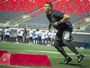 Jonathan Jones pushes through a drill during the the Ottawa RedBlacks' open tryouts that took place at TD Place Saturday, April 23, 2016. Jones is one of 18 children in his family.