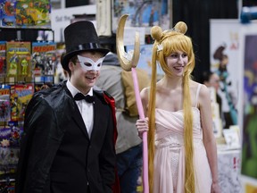 Cosplayers Evan Friesen, dressed up as Tuxedo Mask, and Katrina Schmalz as Princess Serenity from the  popular Japanese animation Sailor Moon, shop for fan merchandise at the Ottawa Geek Market held at the Nepean Sportsplex on Saturday, April 9, 2016.