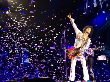 In this 2014 photo released by NPG Records, Prince performs in Birmingham, England. On Tuesday, Sept. 30, 2014.