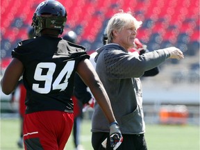 Mark Nelson, Defensive Coordinator of the Ottawa RedBlacks directs a drill during a mini camp at TD Place in Ottawa, April 24, 2016.