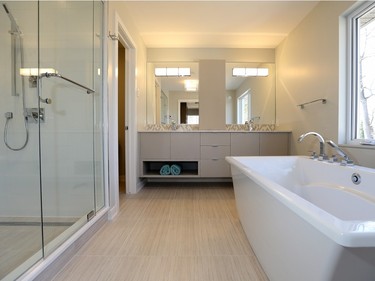 An inviting master ensuite offers lots of room for pampering.