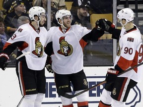 From left, Ottawa Senators' Mika Zibanejad, Mike Hoffman and Alex Chiasson (90) celebrate a goal in the second period of an NHL hockey game against the Boston Bruins, Saturday, April 9, 2016, in Boston.