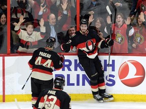 Ottawa Senators' centre Mika Zibanejad (93) celebrates a first period goal against the Florida Panthers with Jean-Gabriel Pageau (44) and Nick Paul (13) back in early April.