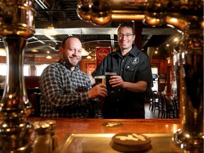 Operations Manager, Brett Baigrie (left), and Patrick Fiori, Head of Brewery Operations, enjoy some of the fruits of their labour at the Clocktower Brew Pub, Bank Street location.
