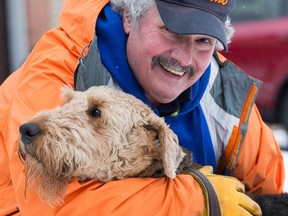 Orléans resident Dave MacDonald, 60, with his dog Eddy, who is still recovering from an adverse reaction to a rabies vaccine.