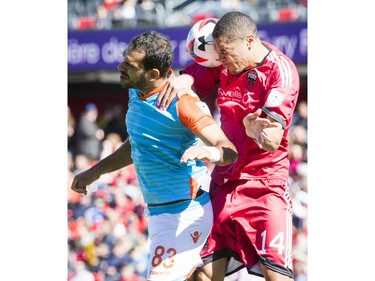 Ottawa Fury FC's Onua Thomas Obasi goes for a header against Miami FC's Pablo Campos during the Fury's home-opener Saturday April 30, 2016 at TD Place.   Ashley Fraser