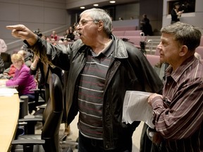 Ottawa taxi driver Tony Hajjar yells at council after they passed regulations to allow Uber to operate legally in the city after a meeting at City Hall Wednesday April 13, 2016. Hajjar says his plates is worthless after driving for 36 years and owning a plate for 20 years. (Darren Brown).