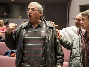 Ottawa taxi driver Tony Hajjar yells at council after they passed regulations to allow Uber to operate legally in the city after a meeting at City Hall Wednesday April 13, 2016. Hajjar says his plates are worthless after driving for 36 years and owning a plate for 20 years. (Darren Brown).