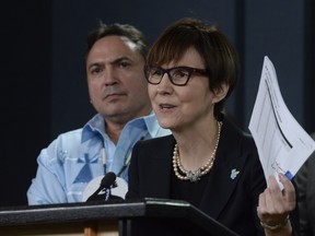 Assembly of First Nations National Chief Perry Bellegarde looks on as First Nations Child and Family Caring Society Caring Society Executive Director Cindy Blackstock speaks about First Nations children in care earlier this year.