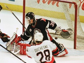 Sens' Steve Duchesne watches his shot go past Sabres Dominik Hasek during third period action in 2005.