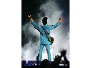 In this Feb. 4, 2007 file photo, Prince performs during the halftime show at Super Bowl XLI at Dolphin Stadium in Miami.