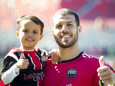 Rafael Alves along with his son Joao after the Ottawa Fury FC won against the Miami FC for the Fury's home-opener Saturday April 30, 2016 at TD Place.   Ashley Fraser