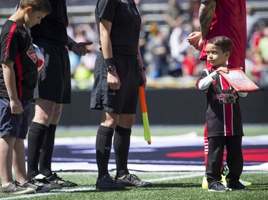 Rafael Alves's son Joao keeps an eye on the ball while the players walked out on the field. The Ottawa Fury FC host the Miami FC for the Fury's home-opener Saturday April 30, 2016 at TD Place.   Ashley Fraser