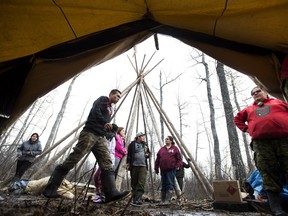 Rangers and indigenous teenagers set up camp at a young bush camp taught by Rangers which teaches survival skills in the northern Ontario First Nations reserve in Attawapiskat, Ont., on Wednesday, April 20, 2016.