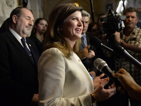 Conservative Party interim leader Rona Ambrose speaks to reporters about the federal budget on Parliament Hill, Tuesday, March 22, 2016 in Ottawa.