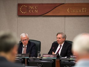 Russell Mills, (L) NCC Chair, and Mark Kristmanson, CEO, as the NCC's board of directors announce their vote on recommendations on how to proceed with the development of LeBreton Flats at its Thursday meeting.