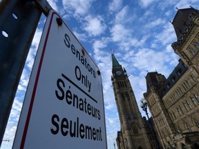 A "Senators Only" parking sign is displayed on Parliament Hill in Ottawa on Tuesday, November 5, 2013. THE CANADIAN PRESS/Sean Kilpatrick