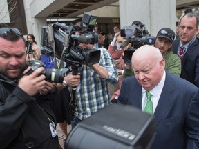 Sen. Mike Duffy is mobbed by the media outside the Elgin Street Courthouse following his acquittal last week.