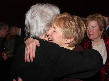 Sharon Johnston hugs Gerda Hnatyshyn at a reception held at the National Arts Centre on Tuesday, April 19, 2016, as part of the launch event of Governor General David Johnston's new book, The Idea of Canada: Letters to a Nation, presented by the Ottawa International Writers Festival. (Caroline Phillips / Ottawa Citizen)