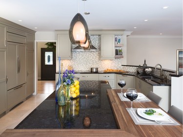 2nd place, kitchen, classic/traditional, $40,000-$59,999: Walnut butcher block set against dark granite creates an island focal point in this project by Julia Enriquez of Astro Design Centre.