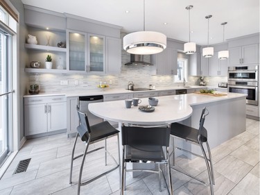 2nd place, kitchen, contemporary/modern, $20,000-$39,999: A 12-foot-long island ending in a circular eating bar defines this grey and white kitchen by Elnaz Shahrokhi of Laurysen Kitchens.