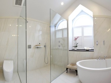 2nd place, bathroom, contemporary/modern, $25,000-$39,999: Seeking the feel of a luxury hotel, Colin Meredith of Perspective Renovations designed a curb-less and door-less shower and paired it with an oval soaker tub.