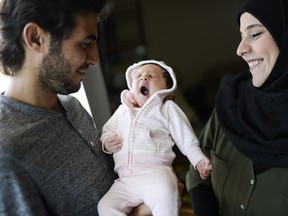 Ebrahim Alahmad and his wife, Amina Mohamad, with their daughter, Marya, who is likely the first baby to be born in Ottawa among the 1,500 Syrian refugees who have been arriving here since late in 2015.