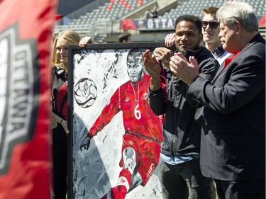 The Ottawa Fury FC host the Miami FC for the Fury's home-opener Saturday April 30, 2016 at TD Place. Julian De Guzman was presented with a large painting prior to the game.   Ashley Fraser
