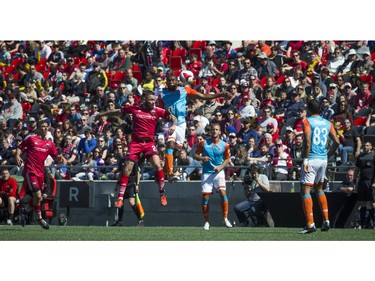 The Ottawa Fury FC's Jonny Steele goes for the ball against Miami FC's Wilson Palacios during the Fury's home-opener Saturday April 30, 2016 at TD Place.   Ashley Fraser