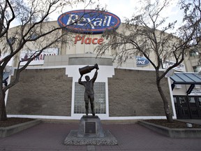 The Wayne Gretzky statue stands in front of Rexall Place home of the Edmonton Oilers in Edmonton, Alta., on Saturday April 2, 2016. The circular concrete rink in the city's north end hosted its final Edmonton Oilers hockey game Wednesday.