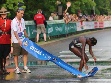 Race winner Peres Jepchirchir of Kenya collapses at the 10K finish line.